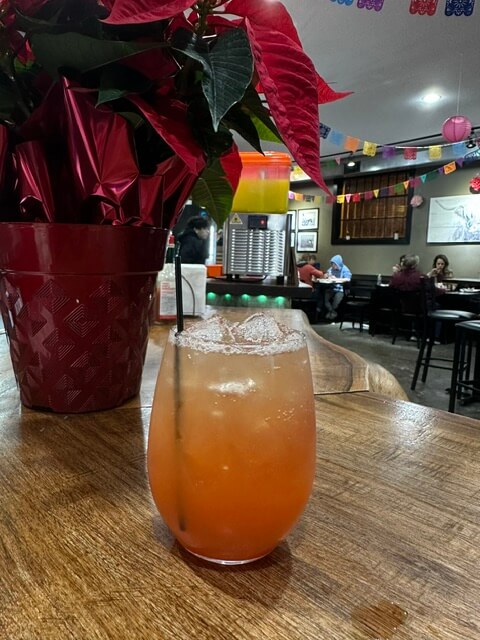 Colorful drink on wooden table